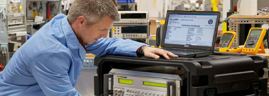 ENI Labs Technician Using a Calibrator