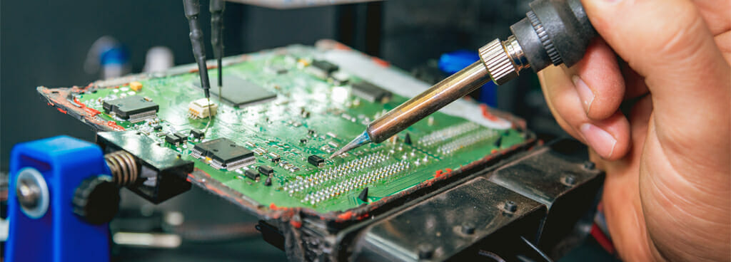 Technician Repairing Circuit Board